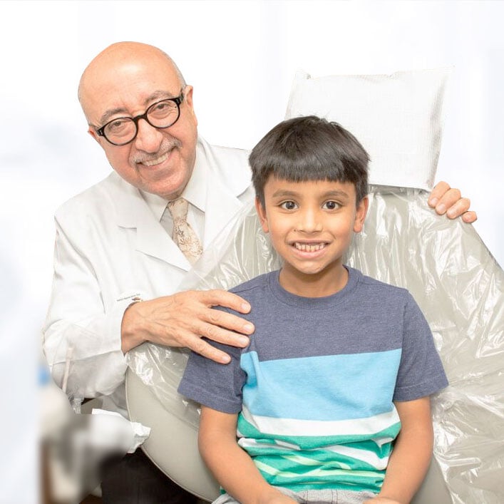 Dr. Farhad Moshiri with kid patient