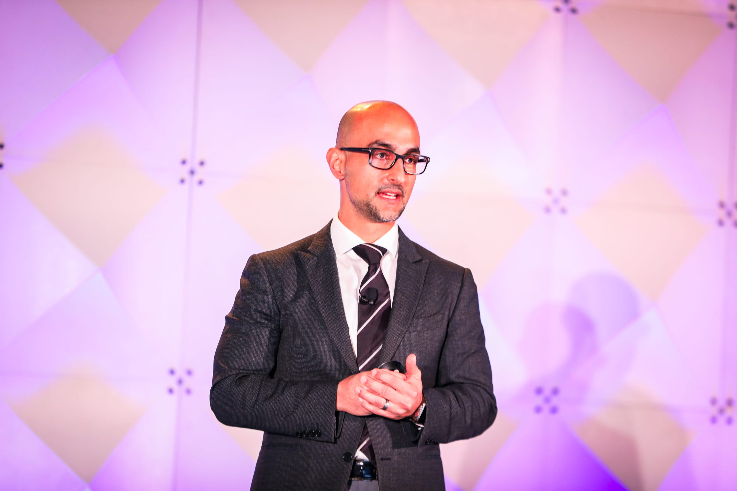 Dr. Maz speaking at a speaking engagement