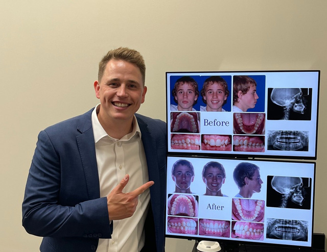 Dr. Charlie Boehm with computer screens displaying before/after pictures