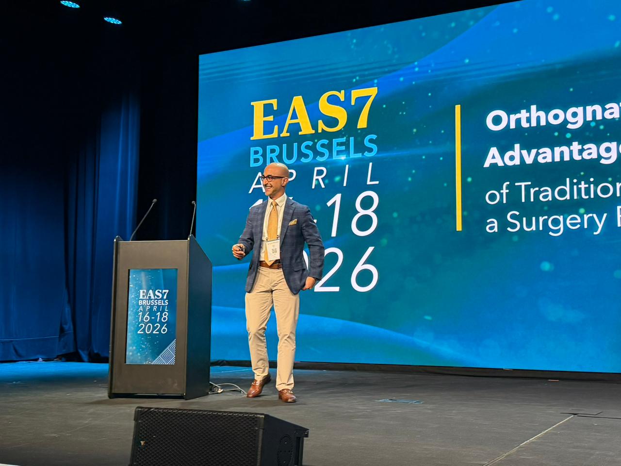 Dr. Maz speaking at a conference
