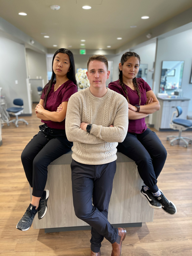 Dr. Boem and two dental assistants